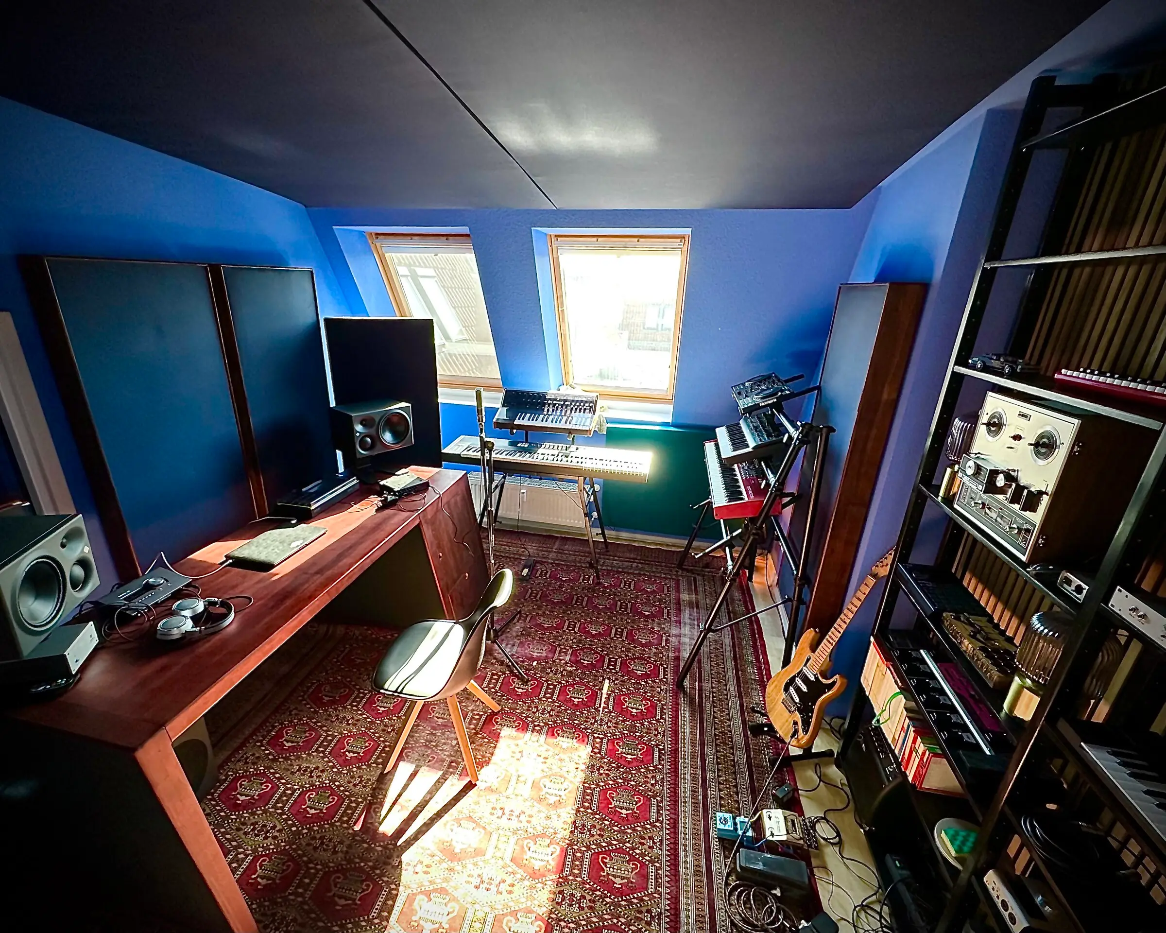 The finished control room with desk, monitors, carpet and instruments